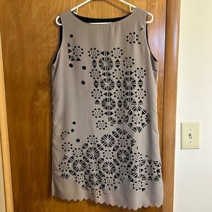 Laser cut dress. Black sheath underdress. Taupe colored over dress.  Size L.